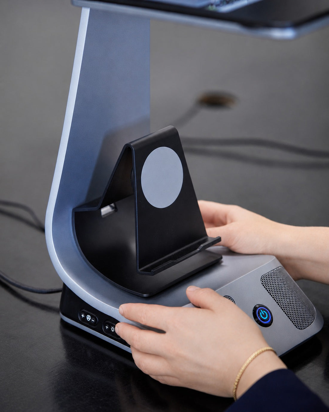 iVi phone holder accessory being attached to the stand.